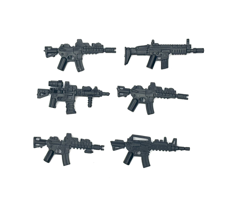 Six black toy guns arranged in two rows on a white background