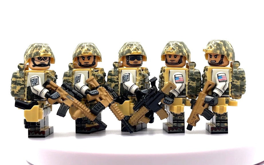 Five toy soldier minifigures in tan and green camouflage uniforms holding rifles, arranged side by side on a white surface against a white background. Fabled Figs