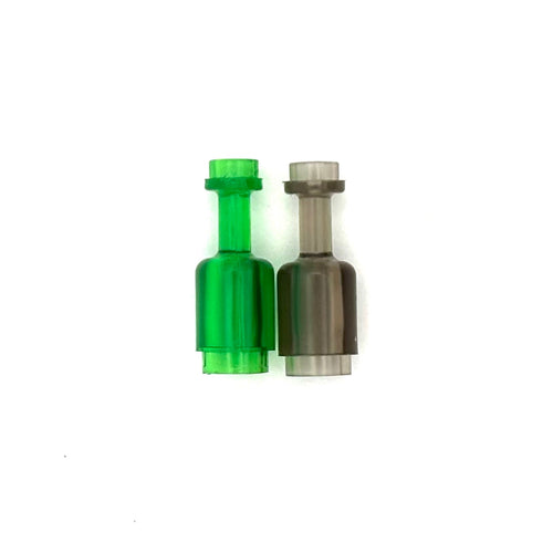 Two plastic figure bottles, one green and one smokey black. Fabled Figs