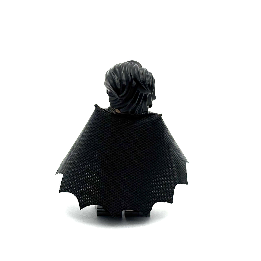 Black cape with pointed ends on a white background Fabled Figs