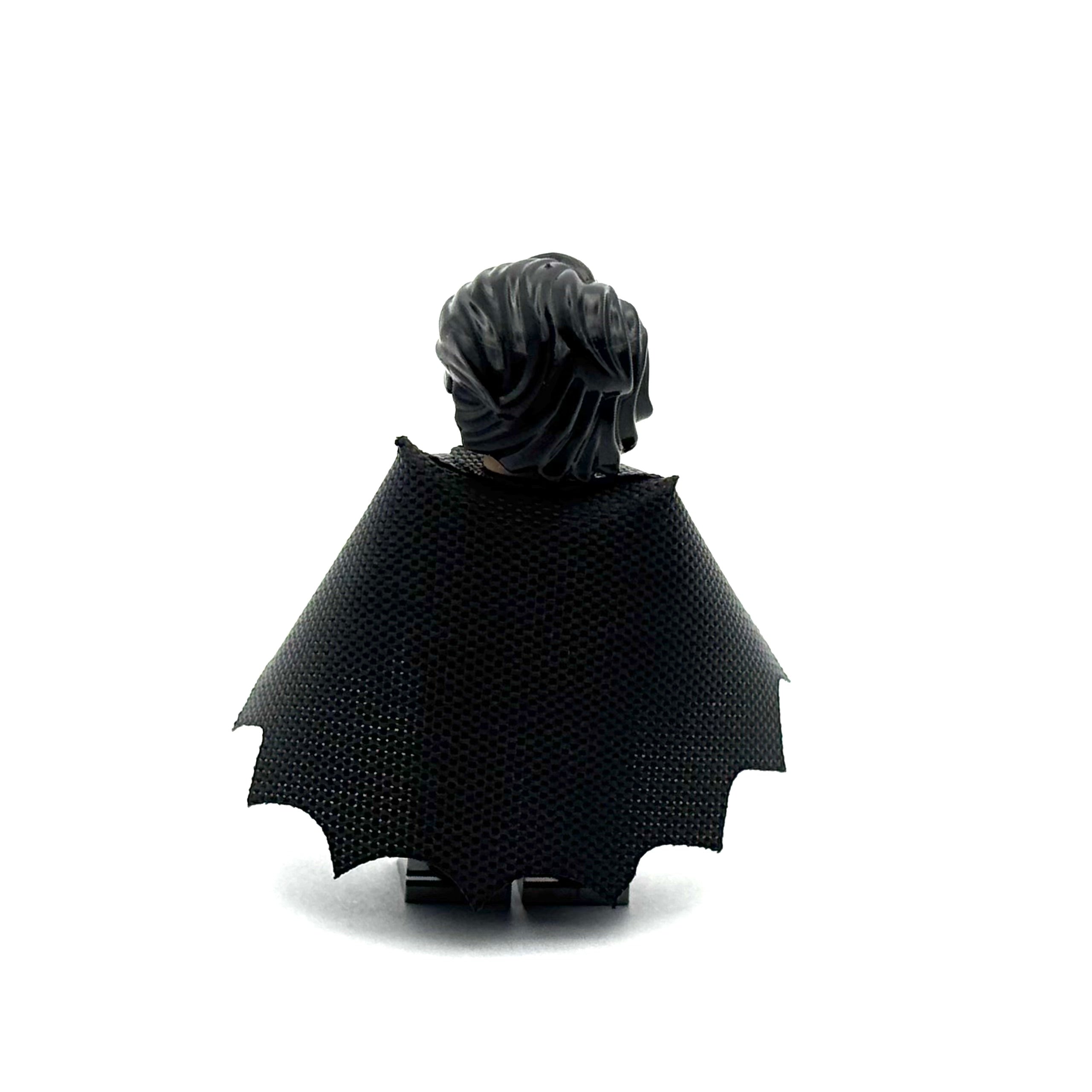 Black cape with pointed ends on a white background Fabled Figs